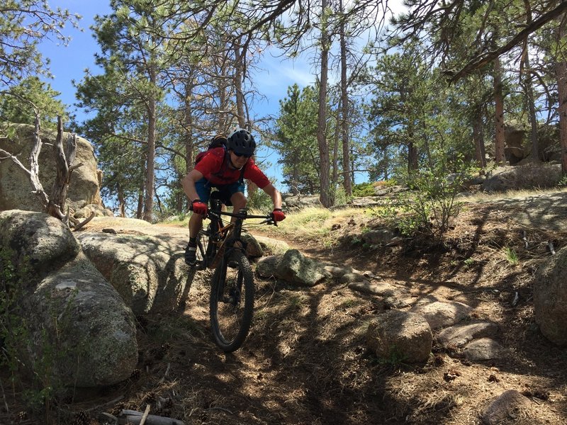 A rider hits a fun drop on El Alto.