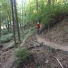 A rider climbs a switchback on the privately owned Haan Trail.