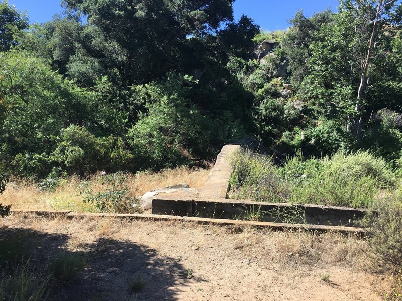 An old concrete dam next to the trail. There are some fun rocks in the trail here, too.