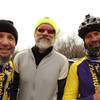 Three guys just riding bikes in the winter.