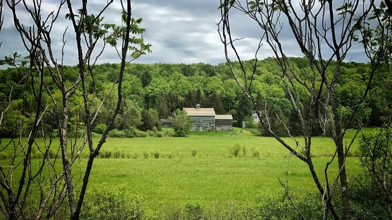 Stately old farm houses, sun-blanched barns, and peaceful pastureland line the D&H Rail Trail.