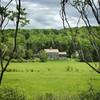 Stately old farm houses, sun-blanched barns, and peaceful pastureland line the D&H Rail Trail.