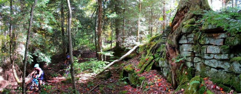 Riders pass a rock formation on the Fork Mountain Trail in early Fall. Photo by Mike Boyes.