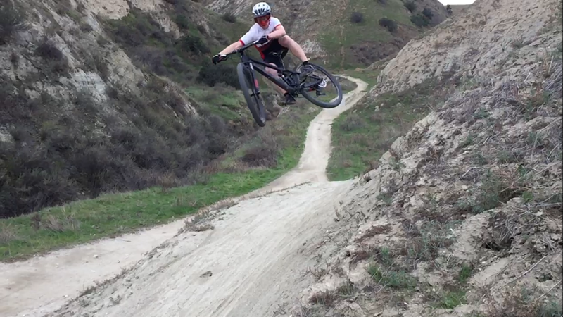 Shreddin' the jumps along Scott Canyon Trail.