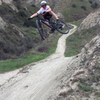 Shreddin' the jumps along Scott Canyon Trail.