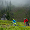 Riders descend below the Warming Hut on Gnar-Gnar on a raining morning.