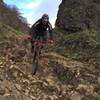 An insanely steep rock garden with a scree field runout.