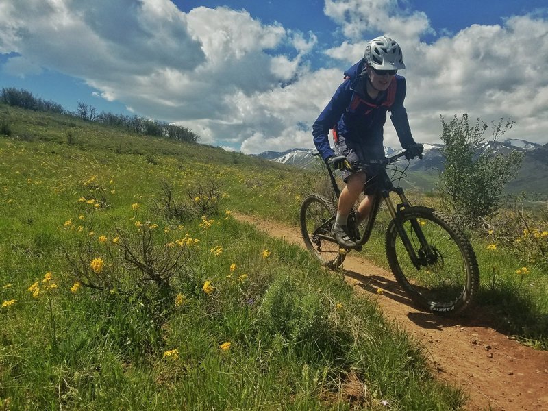 Spring riding only gets better when the wildflowers are out! Photo by Andrew Blackwell.