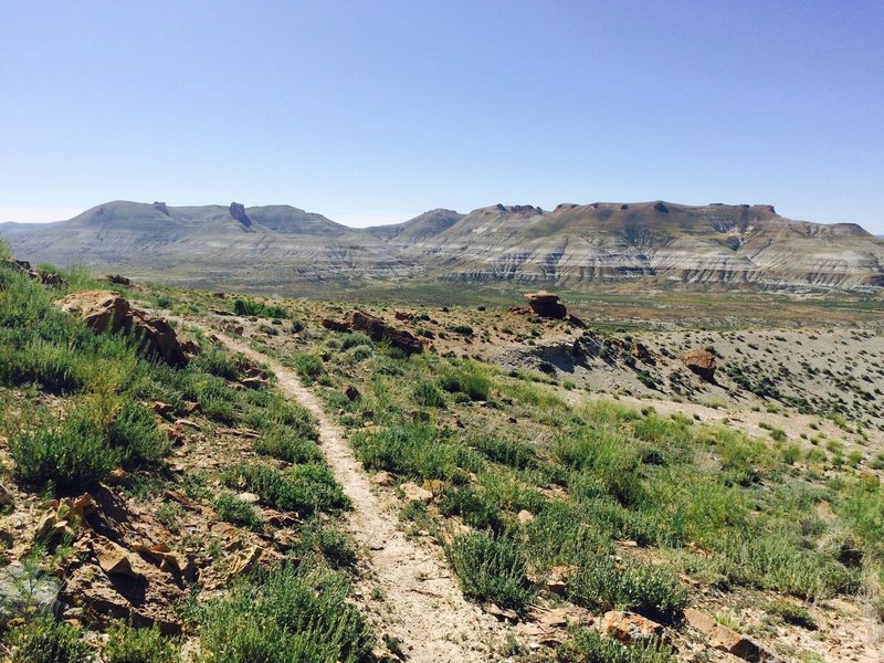 Looking out toward Pulpit And Kissing Rocks. The trail noticeably improves here, with fewer horse footprints and potholes.