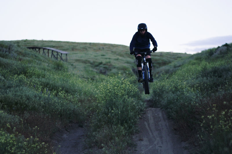 Catching some air on a run down Fred & John's.