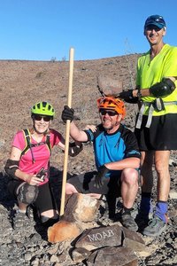 Placing a trail marker on Moab.