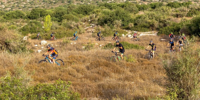 Riders climb a serpentine section of the Adulam Singletrack.