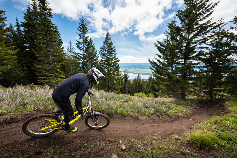 A rider rolls into Super-G for smooth narrow singletrack and great views.