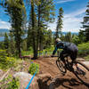 Evan Geankoplis lifts off the slab on Rock Star above a fantastic lake view.