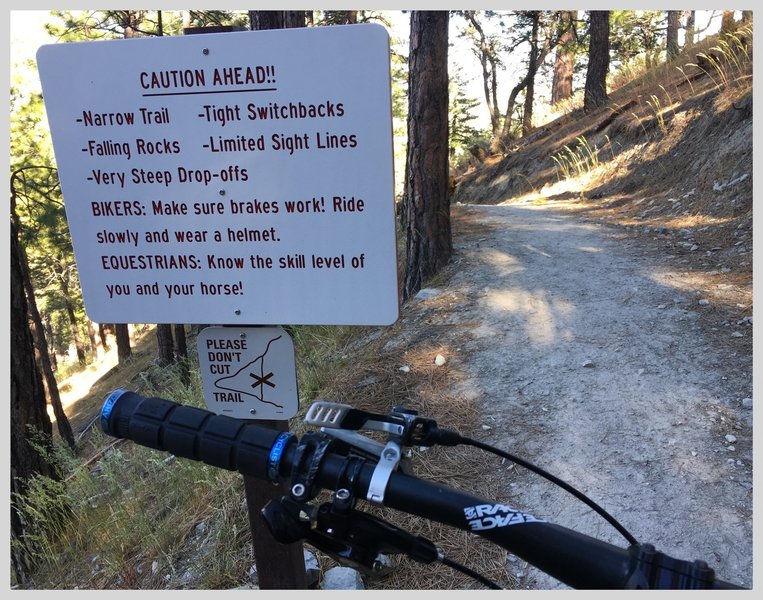 The warning sight at the top of Lower Genoa Canyon Trail seems to cover all the basis for a rowdy descent.