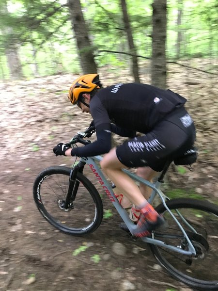 Kevin Bouchard-Hall leading the Wilmington Whiteface 100 Race, on the course in the Blueberry Hill trail system in Elizabethtown NY.  He won with a record time of 4:04:13.