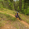 Shari Heier riding in the forest along the Elliot Barker trail. The historic mining roads provide a perfect route for modern mountain biking trails.