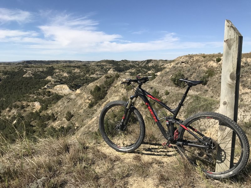 Overlook of the valley, the bike is leaning against the trail markers found along Buffalo Gap trail.