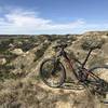 Overlook of the valley, the bike is leaning against the trail markers found along Buffalo Gap trail.