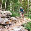 A rider dashes through this short rocky section on the Mesa Top Trail. I hiked it!