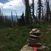 This carin and the USFS sign on the tree mark the nonexistant start to Treasure Mountain Trail.