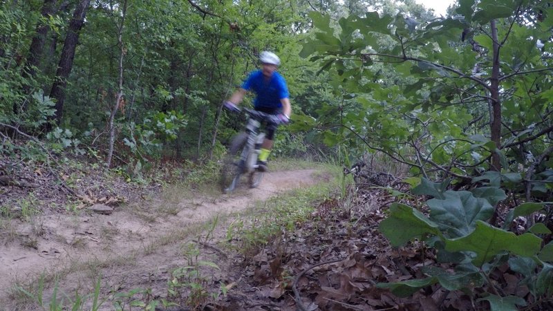 Gaining speed through a slightly rutted section.