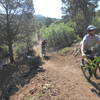 Two riders coming off of the 'C Trail' onto the north end of the 'Highlands Trail' for its grand opening July 8, 2017.