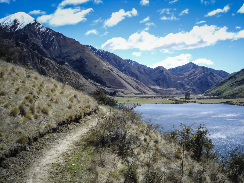 Singletrack above the serene Moke Lake.