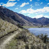 Singletrack above the serene Moke Lake.