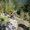 The track clings precariously to a cliff face high above the Mokihinui River.