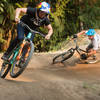 Jill Kintner and Lars Sternberg take an inaugural lap during the pumptrack's grand opening.