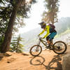 A racer rounds a tight corner against the boulder field on Lichen It.