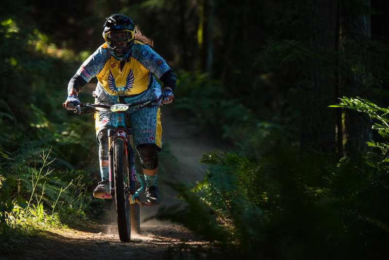 Shannon Sutherland blasts through an early ray of light on a race run on Two Dollar during the Cascadia Dirt Cup.