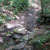 Stream crossing after a steep downhill.