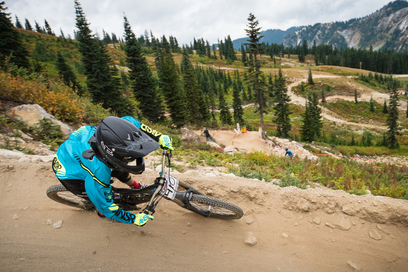 A rider makes his way down the slightly rocky berms on Rock Crusher.