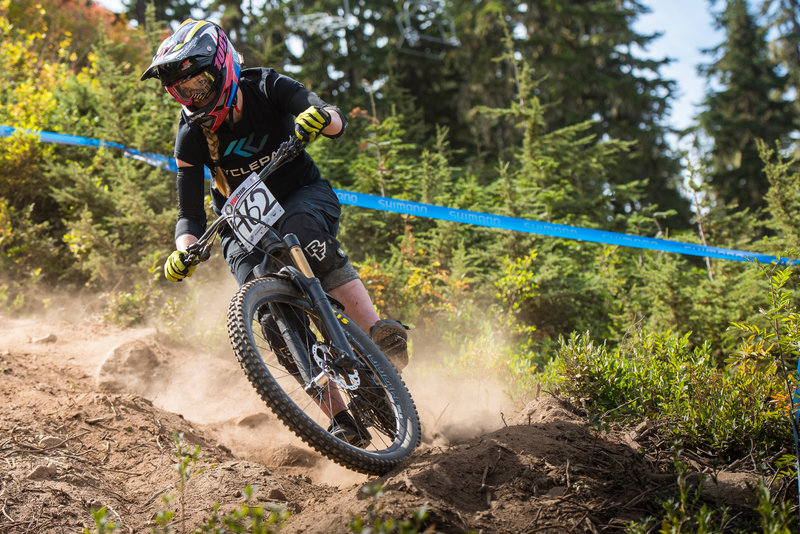 Sarah Olsen rails a dusty berm on Berserker.