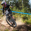 Sarah Olsen rails a dusty berm on Berserker.