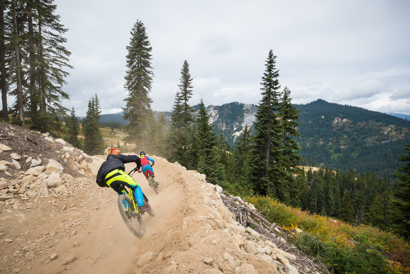 Fast berms and dusty turns. Riders enjoy Rock Crusher at Stevens Pass Bike Park.