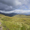 Singletrack leads down to Loch Leven from the top of the Devil's Staircase. Blackwater Reservoir to the right.