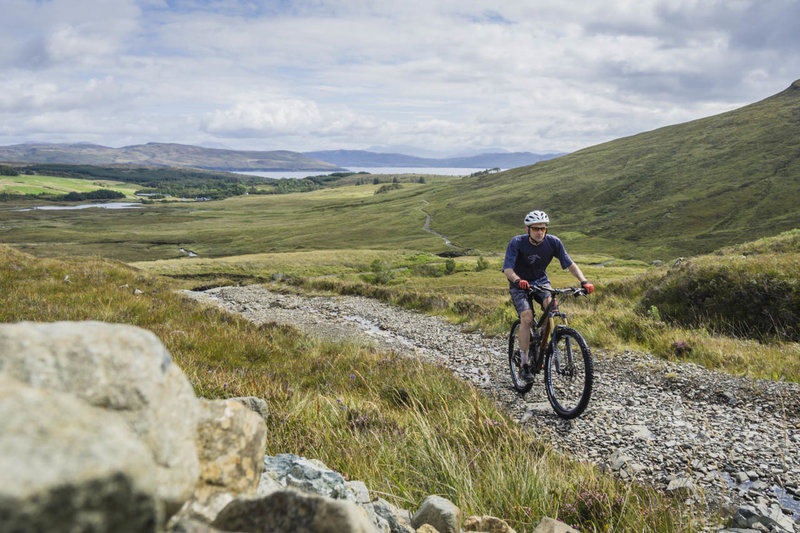 Climbing towards Am Mam pass with Loch Slapin (the Atlantic Ocean) in the background.