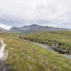 From here the singletrack climbs steadily back behind Beinn Damph