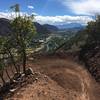 Fresh berm on lower middle Grandstaff Trail, with Roaring Fork River and Mount Sopris in the distance.