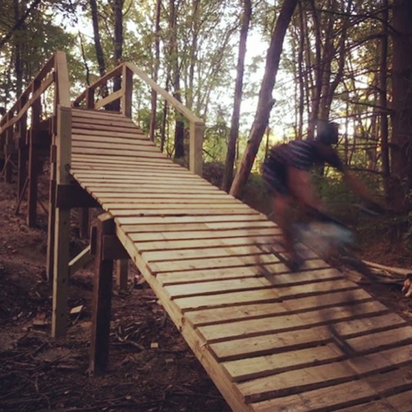 Brandon flying down Zulu's over/under bridge/drop feature.