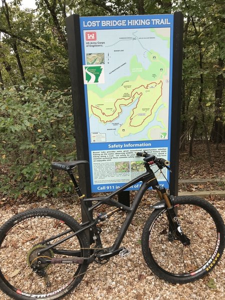 Trailhead sign and bike lean.