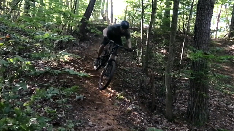 A left off the loop in to a gulley with drops, a berm, and some small jumps. Reconnects with main trail.