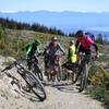 Climbing Widdershins Trail to the top of Involution with Tasman Bay in the background.