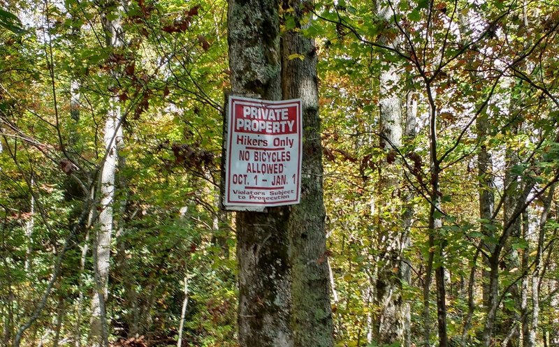 Sign posted to show when Old Mitchell Toll Road is closed.