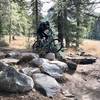 Floating over a fun rock section near the beginning of the trail!