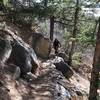 Riding the rock ledge, this section is full of Awesome bench cut sections along the step side slope!