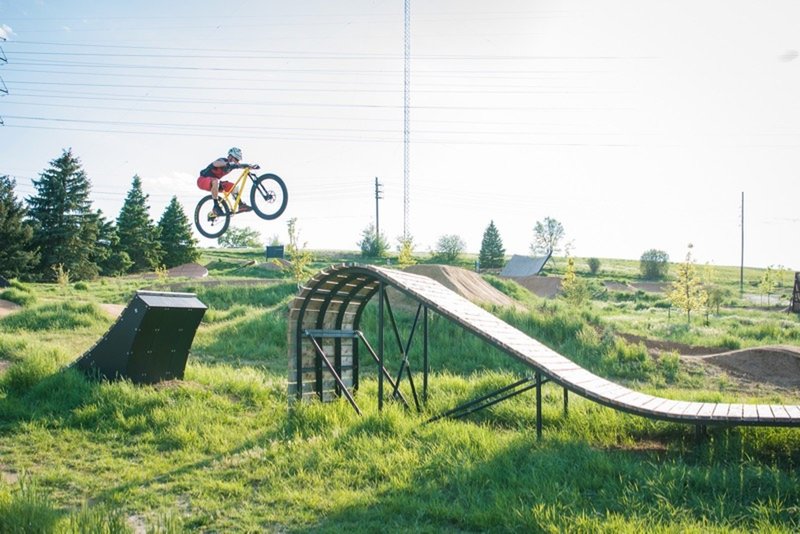 Jumping the wooden 'whale-tail' feature on the XL Slopestyle Line.